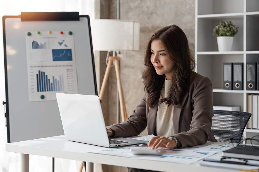 person using a calculator to check company finances and earnings and budget. calculating monthly expenses, managing budget, loan documents. Financial management.