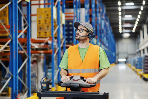 person on forklift in warehouse to represent warehouse distribution software