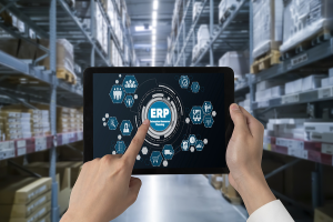 tablet in warehouse showing ERP distribution software